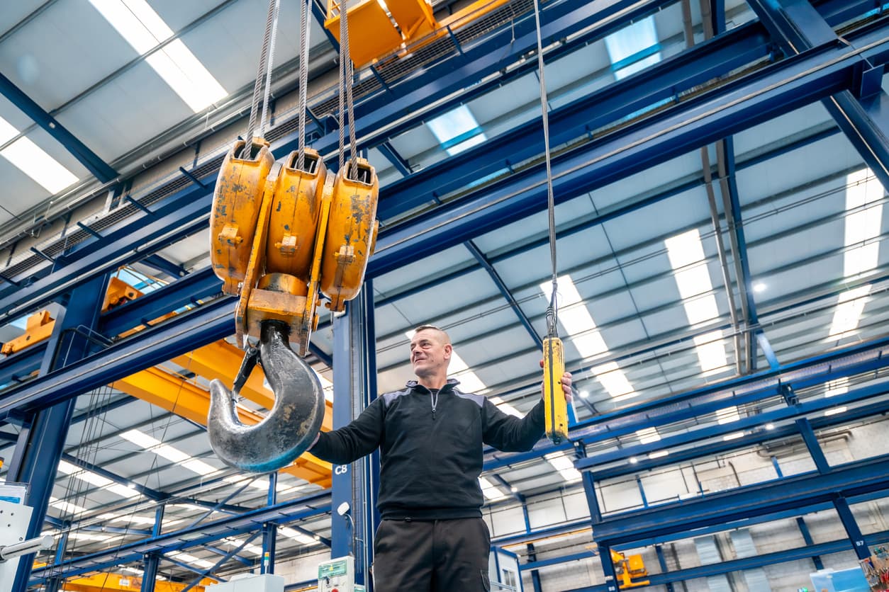 Wide view of a lifting-equipment depot — slings, hoists, harnesses